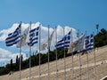 Row of Greek and Olympic Flags Royalty Free Stock Photo