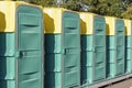 A row of green mobile toilet cabin Royalty Free Stock Photo