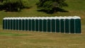 Row of green portable toilets