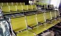 A row of green seats at the airport. Waiting hall.Passenger seats in departure lounge at airport terminal. Interior of airport ter Royalty Free Stock Photo