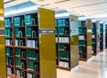 Row of green thesis in the large bookshelf in Chul