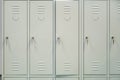 A row of grey metal school lockers with keys in the doors Royalty Free Stock Photo