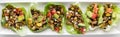 A row of ground turkey taco lettuce wraps on a white platter. Royalty Free Stock Photo