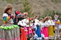 Enciso, Spain Ã¢â¬â March 5, 2022: Elderly woman on the left disguised in a colorful dress holding the straps of a donkey.