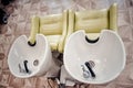 a row of hair washing sinks. white washbasins for hairdresser Royalty Free Stock Photo