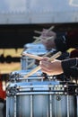 Row of hands with drumsticks playing snare drums outside Royalty Free Stock Photo