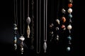 a row of hanging necklaces on a black background Royalty Free Stock Photo