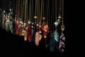 a row of hanging necklaces on a black background Royalty Free Stock Photo