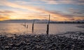 Row of herring fishing posts at Minehead bay on the Bristol Channel at high tide