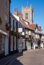 Row of historic characterful buildings in Tombland, Norwich city centre, Norfolk UK. Church spire behind.