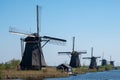 Row of historic windmills at Kinderdijk, Holland, Netherlands, a UNESCO World Heritage Site. Royalty Free Stock Photo