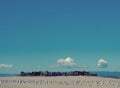 Hotels Houses on Beach with Seagulls and Clouds Big Sky Royalty Free Stock Photo