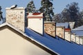 Row of house chimneys wintertime