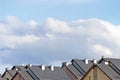 Row house roofs, large detailed panoramic roofscape, condo rowhouse rooftop detail panorama, multiple condos, bright blue summer