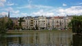 Row of houses in eclectic art nouveau style on the embankment of Ixelles lakes and Sainte-Croix church