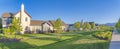 Row of houses with lawn and two concrete walkways on the sides at the front at Daybreak Royalty Free Stock Photo