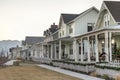 Row of houses with ornamental christmas decorations at the fence and porch Royalty Free Stock Photo