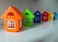 row houses representation. Bunglow symboles on a row with orange in focus and rest with blurred effect. Royalty Free Stock Photo