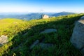 row of huge rocks on a grassy hill. Royalty Free Stock Photo