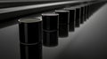 A row of identical black cylindrical containers. Royalty Free Stock Photo