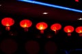 Row of illuminated chinese lanterns on dark background