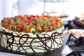 Row of individual serving of desserts whit strawb