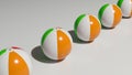 Row of inflatable beach balls on white background in perspective view Royalty Free Stock Photo