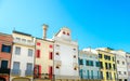 Row of Italian residential buildings colorful blue sky european flat colorful terraced houses historic