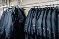 Row of jackets on hangers, clothing store, fabric