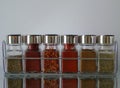 Jars of Herbs and Spices in Spice Rack