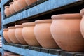 Row of large brown clay flower pots. Royalty Free Stock Photo