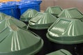Row of large dark green industrial plastic garbage containers Royalty Free Stock Photo