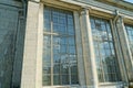 A row of large old windows on a gray stone wall Royalty Free Stock Photo