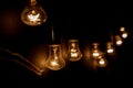 A row of light bulbs. Focus on the closest Royalty Free Stock Photo