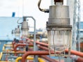 Row of lighting masts with lanterns in explosion-proof and fire-proof design close-up