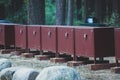 Row line of bear proof food metal storage lockers installed near camping campground in Yosemite National Park, California, United