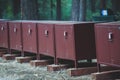 Row line of bear proof food metal storage lockers installed near camping campground in Yosemite National Park, California, United