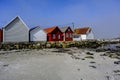 Row Or Line Of Traditional Wooden Beach Huts Facing A Sandy Beach Royalty Free Stock Photo