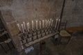 Row of lit candles inside a place of worship in Italy Royalty Free Stock Photo