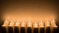 Row of Lit Candles Royalty Free Stock Photo