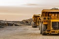 A row of lLarge Mining Dump Trucks for transporting ore rocks Royalty Free Stock Photo