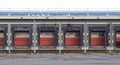 Row of loading docks with shutter doors at an industrial warehouse Royalty Free Stock Photo