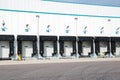 Row of loading docks with shutter doors at an industrial warehouse Royalty Free Stock Photo