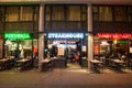 Row of local steakhouse and restaurants in red-light district in Amsterdam, the Netherlands.