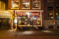 Row of local steakhouses and restaurants at night in red-light district in Amsterdam, the Netherlands. Royalty Free Stock Photo