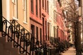 Row of  brick and brownstone New York City apartments seen from outside. Royalty Free Stock Photo