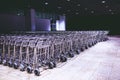 Row of luggage carts trolleys large quantity at modern airport international Royalty Free Stock Photo