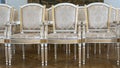 Row of luxury vintage chairs. Chairs for seating the audience at the conference or concert. Theatrical armchairs.