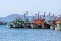 LRow of Malaysian fishing boats at the bay close to Kota Kinabalu Royalty Free Stock Photo