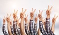 Row of man hands showing victory gesture Royalty Free Stock Photo